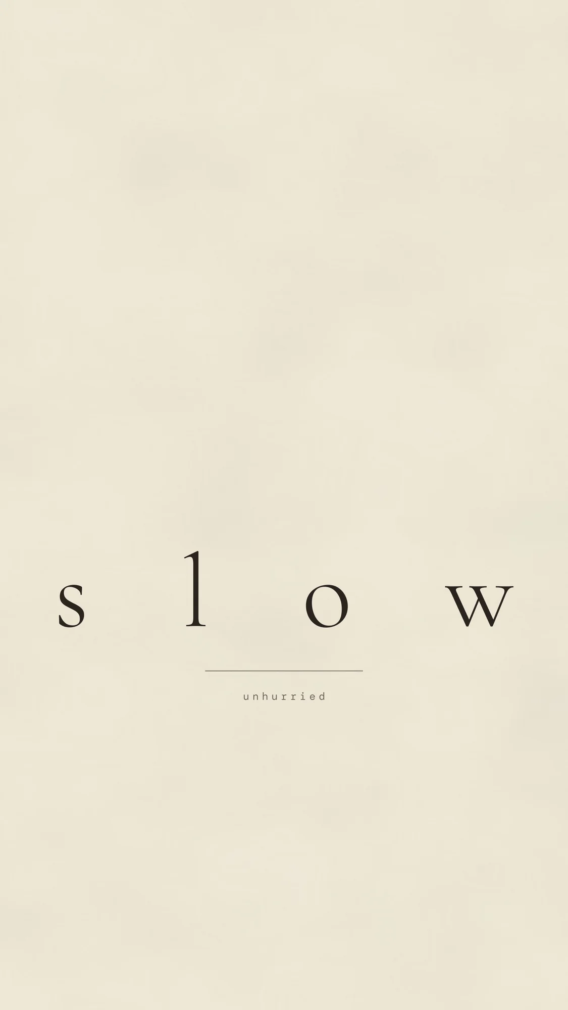 Slow (phone): The word slow set with extreme letter-spacing on cream paper.